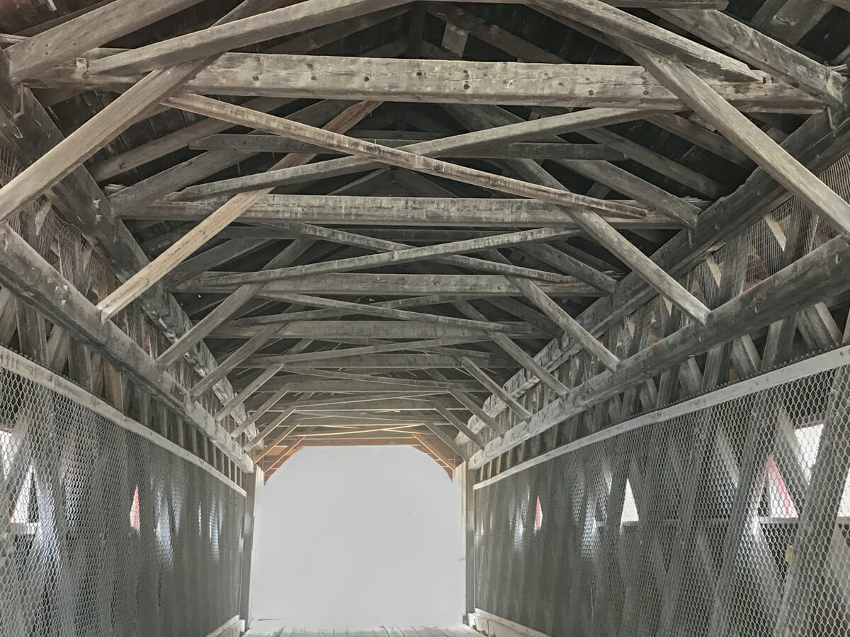 timbers in covered bridge in vermont