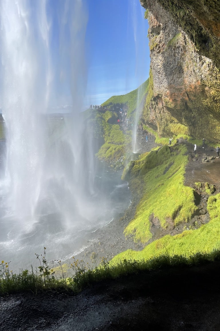 Walking Behind the Cascading Water while cruising Iceland.