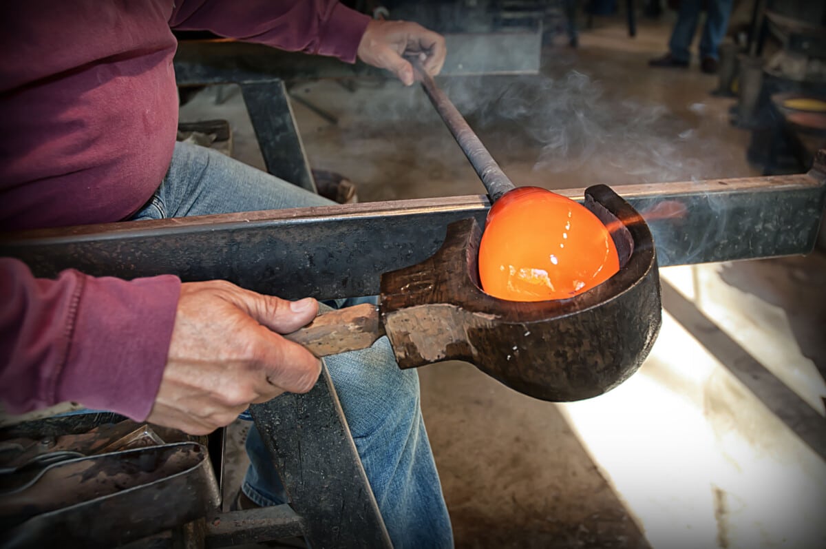 Artisan blowing glass at Dollywood