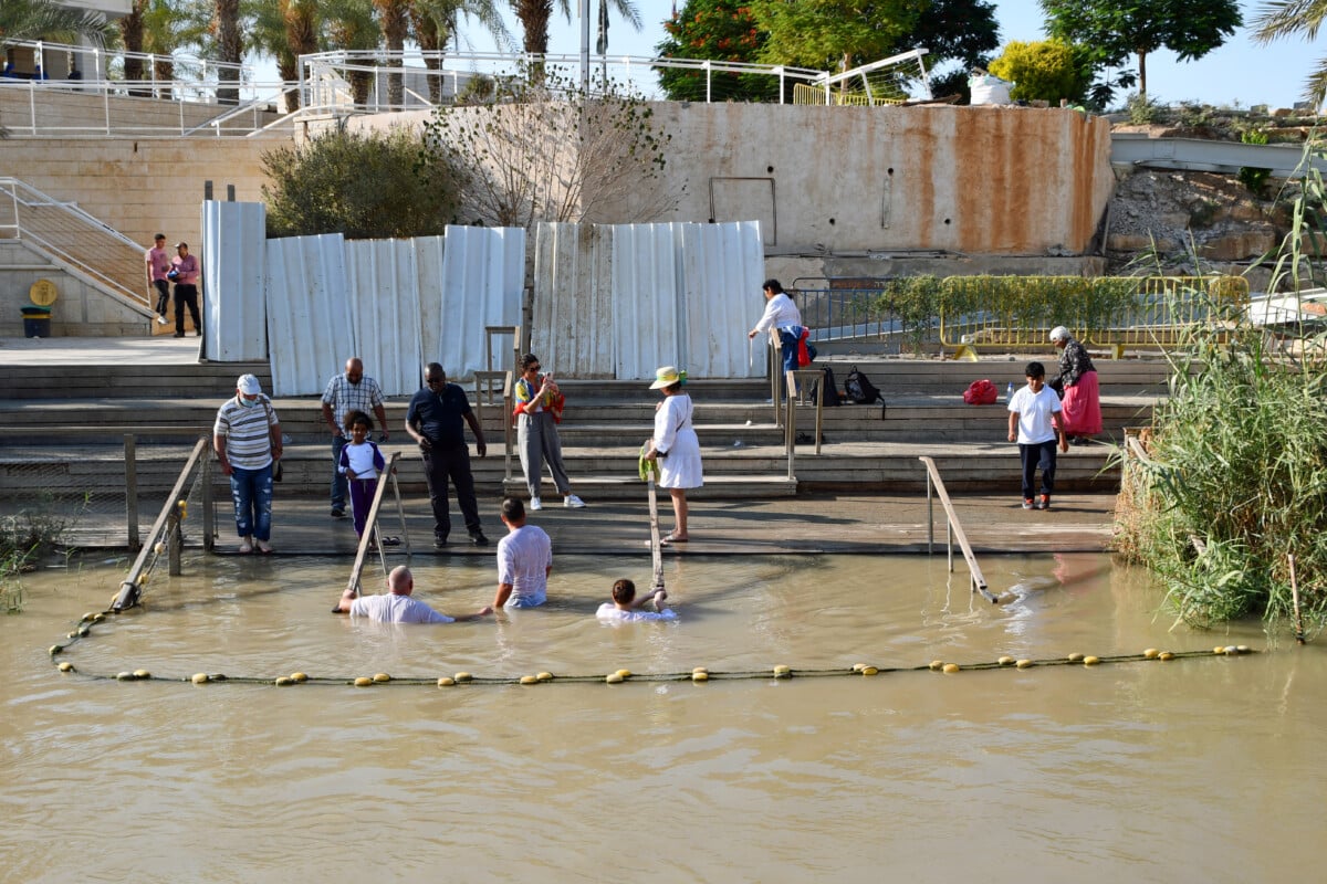 People entered the water at multiple points to be baptized or touch the water near Amman.