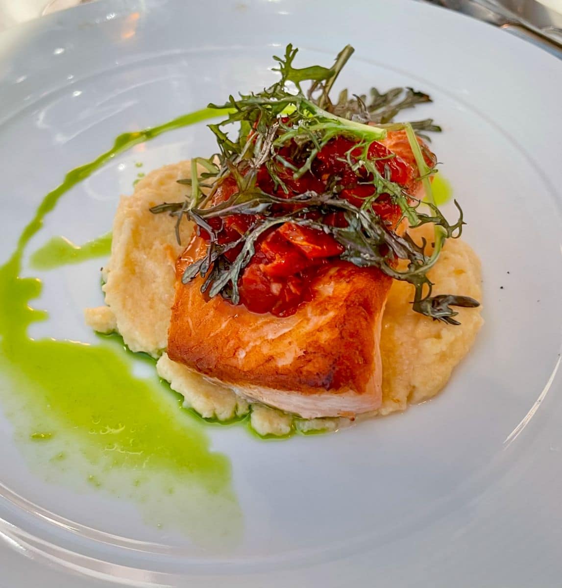 Salmon and polenta with basil oil.