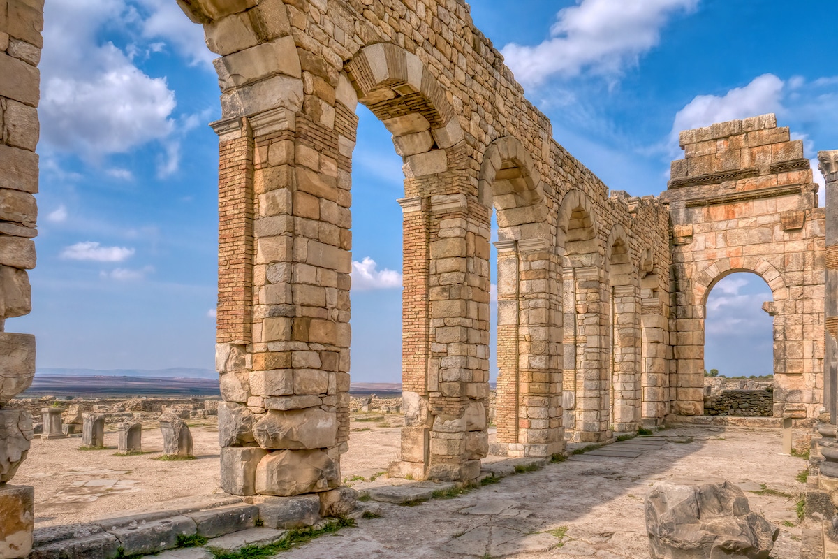 Restored basilica wall at Volubilis Roman ruins in Morocco.
