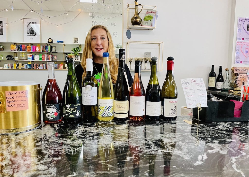 Mickie, the owner of The Buzzed Word, with some of her wines by the glass.