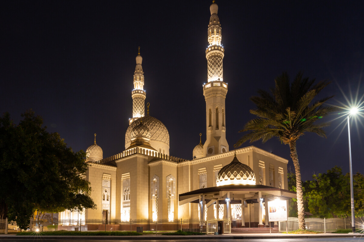 Best Places in Dubai 7 Jumeirah Mosque in Dubai, United Arab Emirates in traditional Fatimid style, illuminated at night.