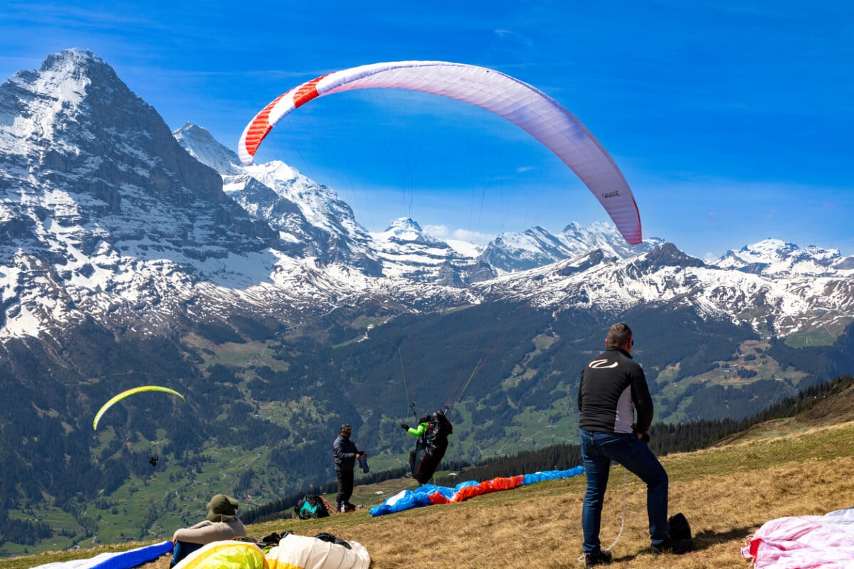 Paraglider getting ready to takeoff with the majestic Swiss Alps in the background. Photo by Willem Cronje via iStock by Getty Images