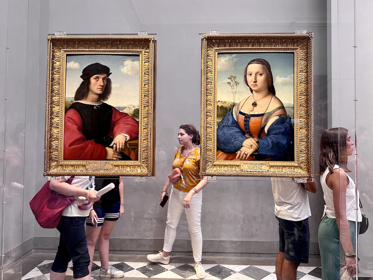 Hotel La Gemma, A Luxury Hotel in Florence 8 Visitors to the Uffizi Galleries in Florence looking at artworks.