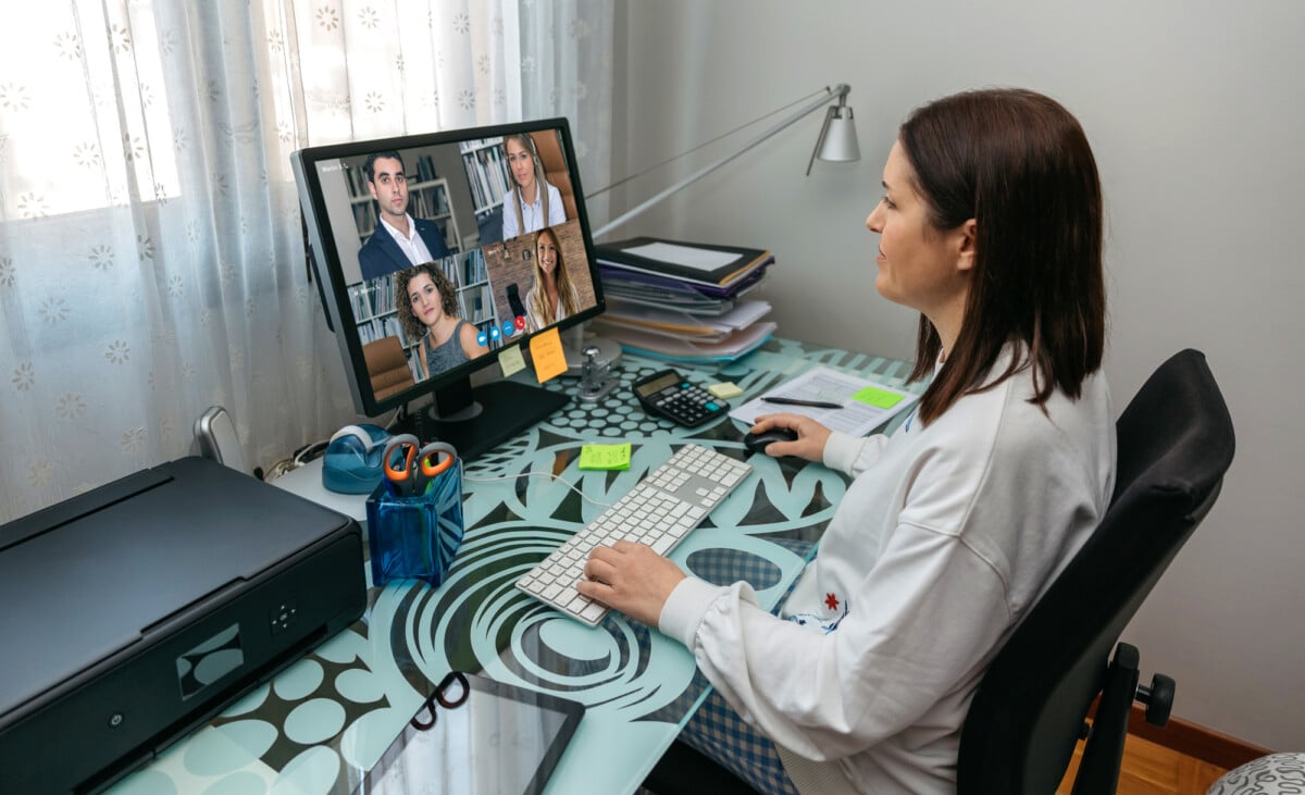 Woman having a video conference work meeting from home