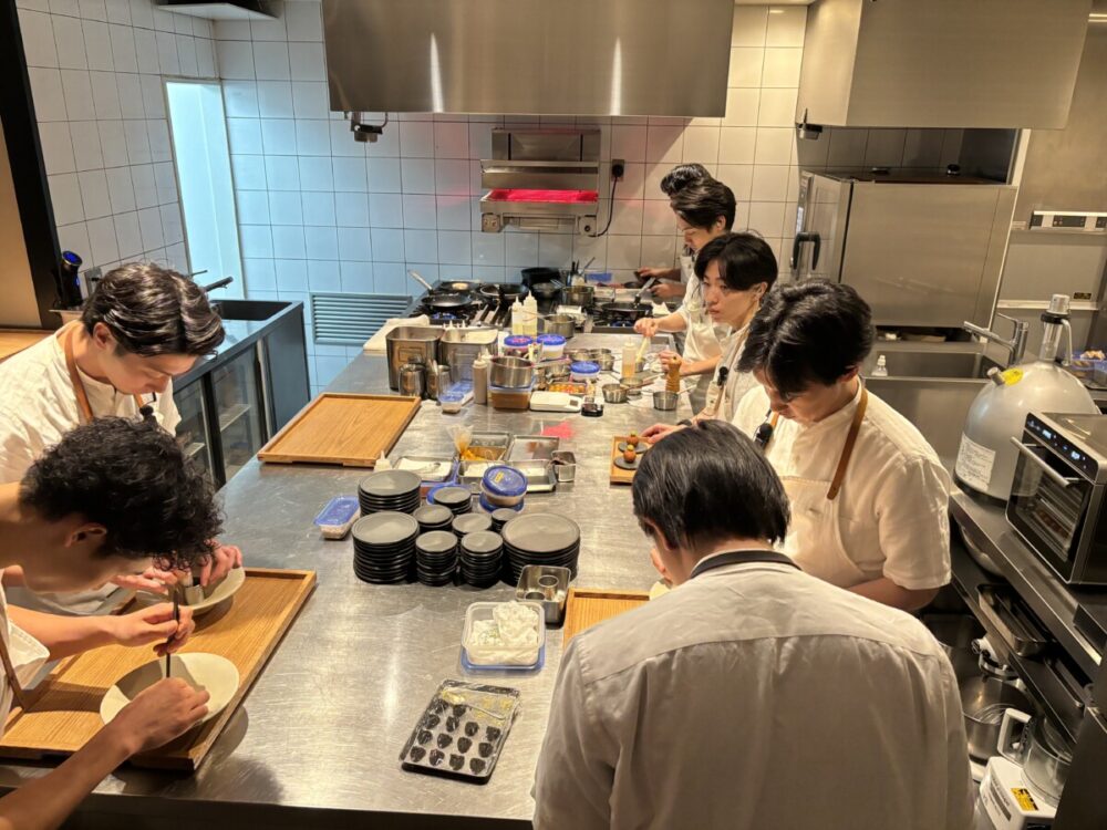While taking the stairs to the dining room at Crony I took this photo of the kitchen crew. Photo by Kurt Jacobson.