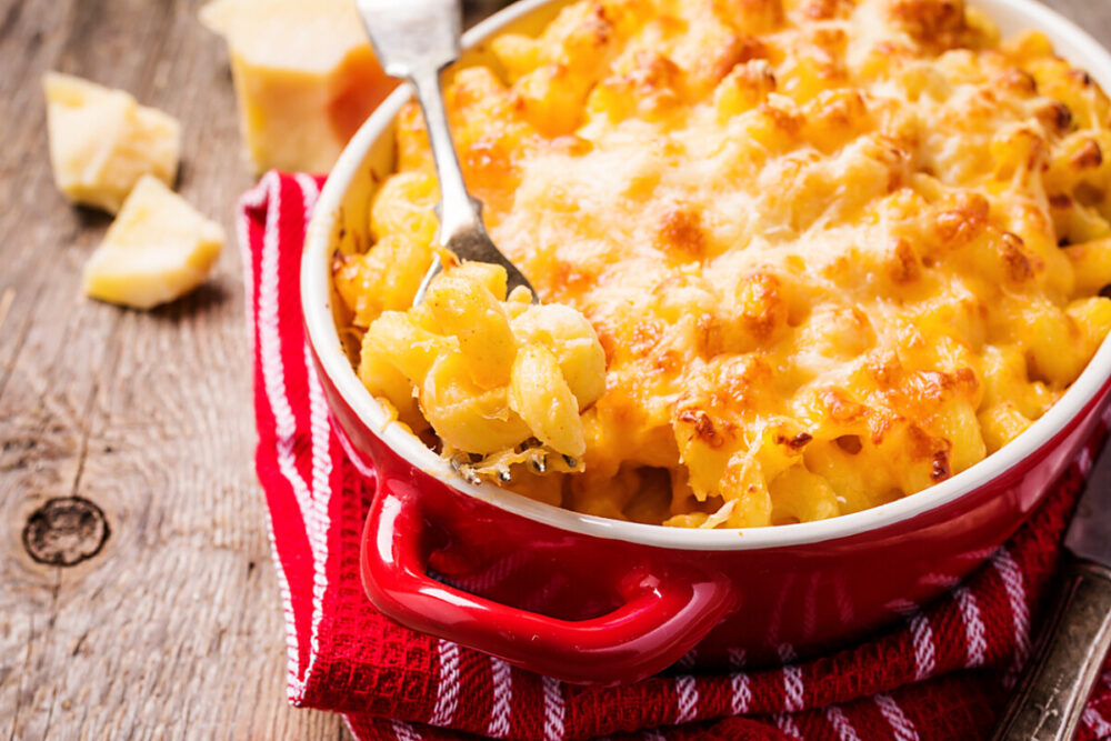 Mac and cheese, american style macaroni pasta in cheesy sauce