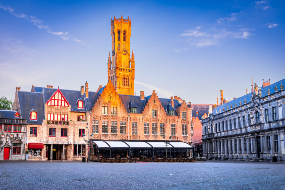 Discover the Charms of Bruges and Knokke-Heist, Belgium 1 Bruges, Belgium. Burg, downtown medieval square with famous Belfry tower, Flanders travel destination.