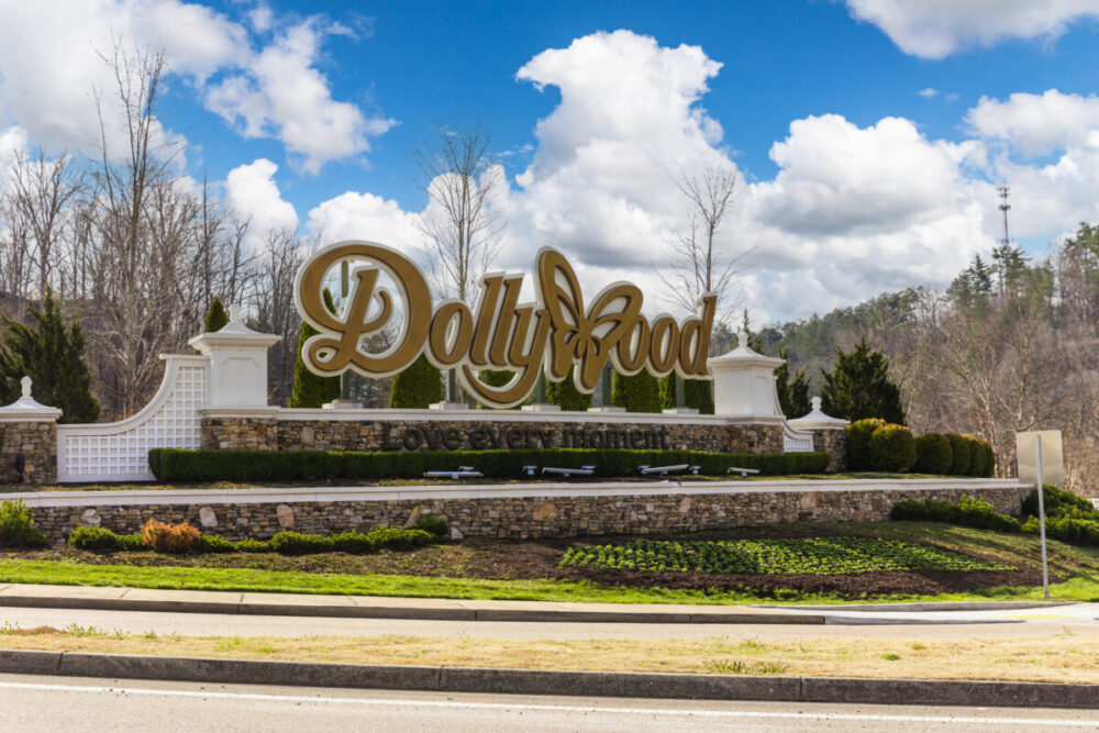 10 Ways to Make the Most of Your Smoky Mountains Vacation 2 Pigeon Forge, TN - March 2022: Dollywood sign near the entrance to the theme park in Pigeon Forge, TN.