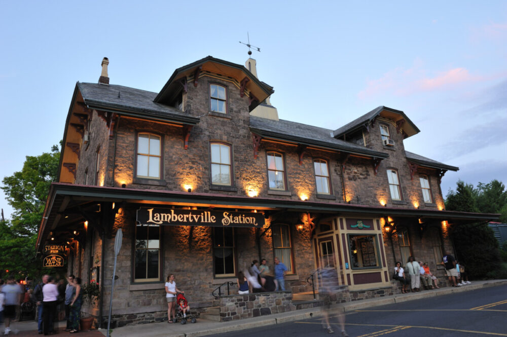A Culinary Journey Through New Jersey: Top Eateries to Explore 5 Lambertville, New Hersey, USA - July 1, 2011. People waiting outside historic Lambertville Station Restaurant. Lambertville Station Restaurant is a landmark in historic town of lambertville, New Jersey. It offers American Cuisine in a restored 19th century train station located on the banks of Delaware River and just steps away from another historic town New Hope in beautiful Bucks County of Pennsylvania. Both towns are crowded with tourists on weekends and holildays for visiting restaurants, antique shops and art galleries and walking along the river and Delaware Canal.