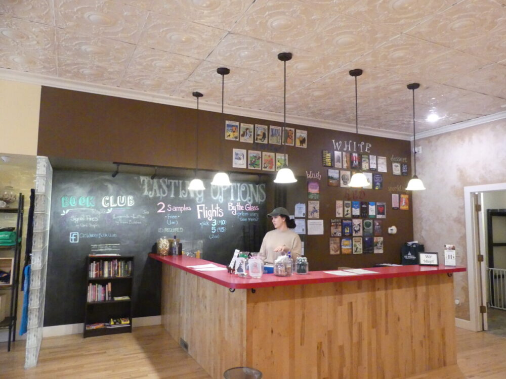 Discover the Magic of a Fun and Quirky Kansas Road Trip 4 Woman at bar in Oz Winery