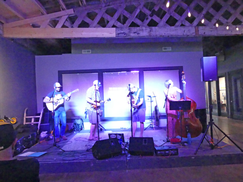 Discover the Magic of a Fun and Quirky Kansas Road Trip 37 Rudy and Lost Boys band playing at The dealership