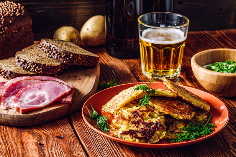 potato-pancakes.-ham-rye-bread-sour-cream-beer