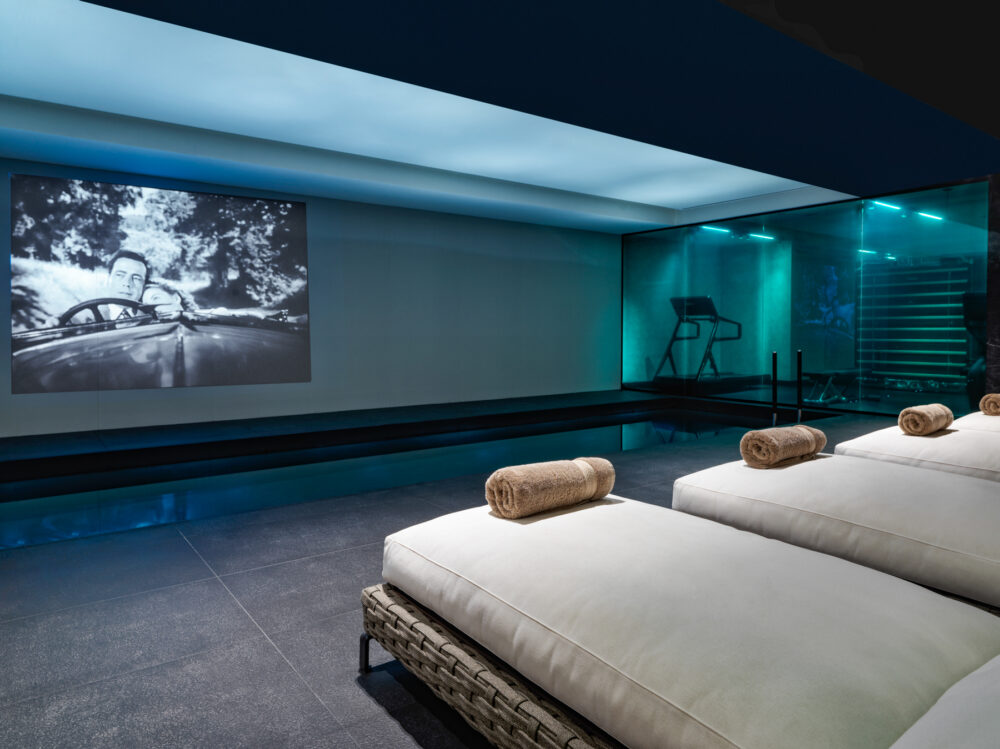 Academias' Orloff Pnoes Wellness Center and pool with classic movies on loop