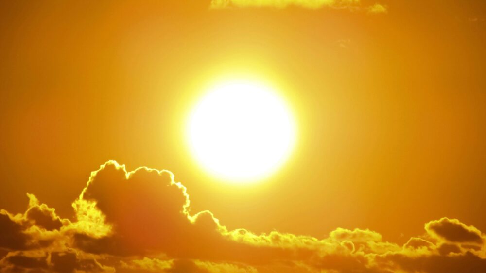 sun glaring onto clouds