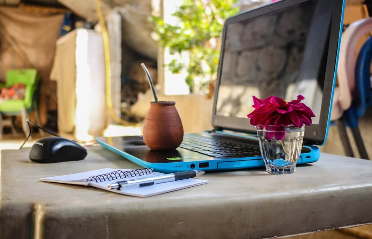 computer on a desk in an exotic tropical location
