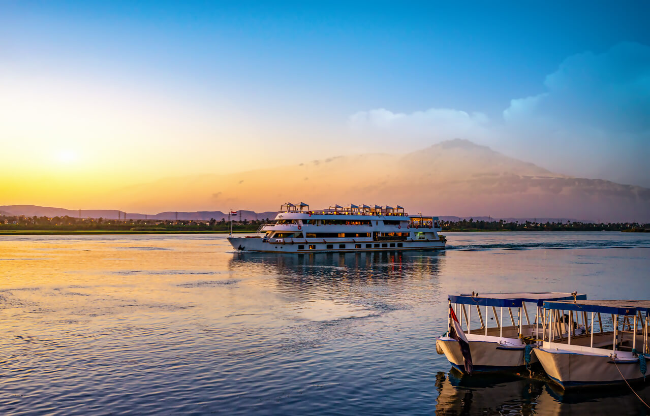 ship on the Nile river cruising at sunset