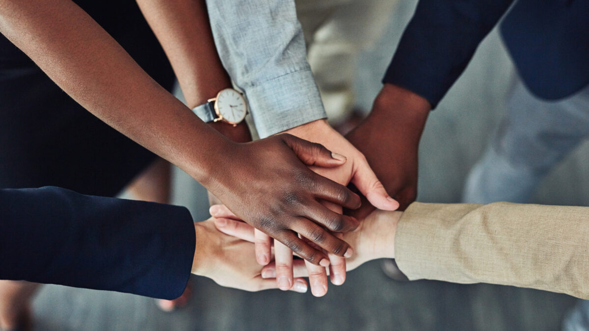 group of hands in a team