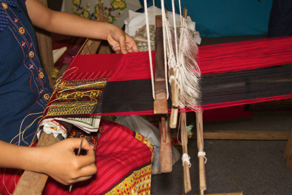 Souvenirs Worth Buying During a Multi-Country Journey 2 Ancient weaving cloth,Women weaving a cloth in Chiang Mai
