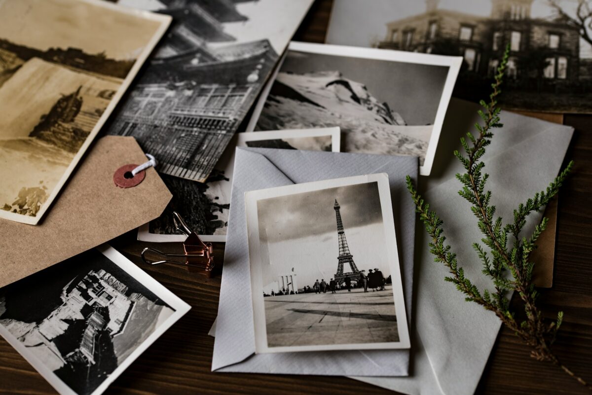 A stack of black-and-white photos of various places, including the Eiffel Tower.
