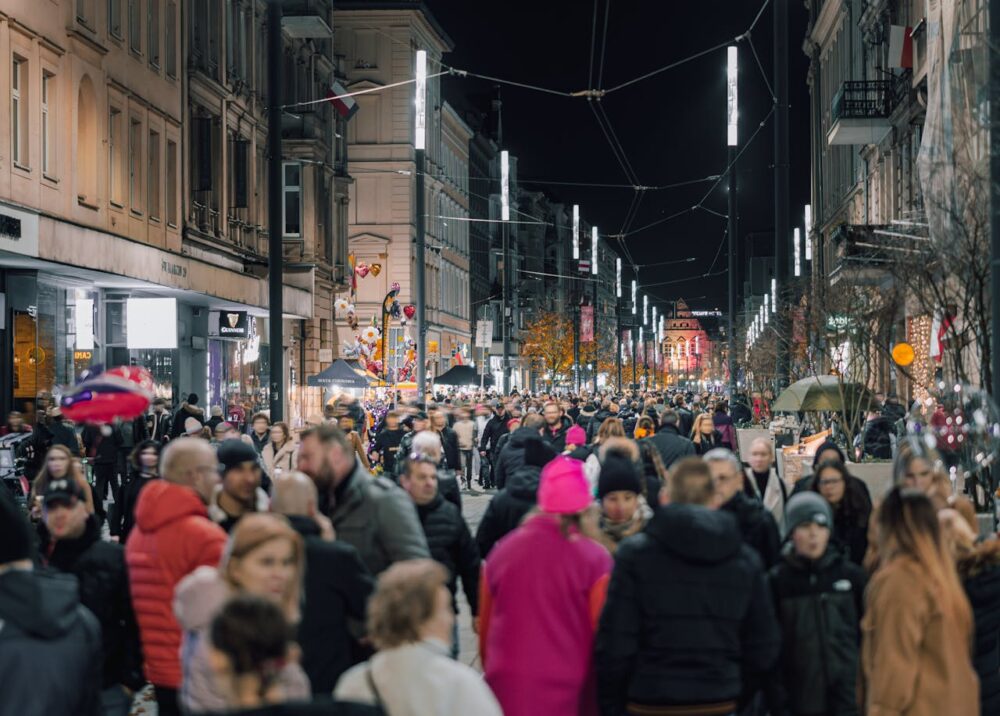 Destination Nightlife: How to Plan Your Evenings Before You Travel 1 pedestrians on the street in Poland in fall