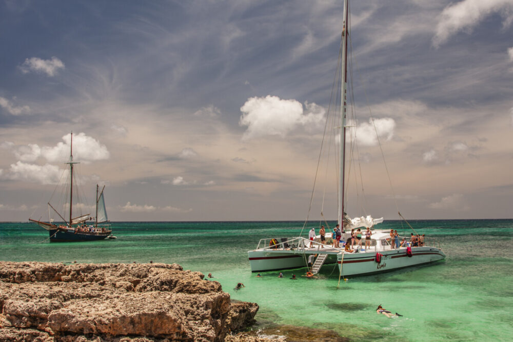 Aruba Yacht Charter: A Luxury Day on the Caribbean Sea 2 Sailboats anchored just offshore. Park of an Aruba yacht charter.