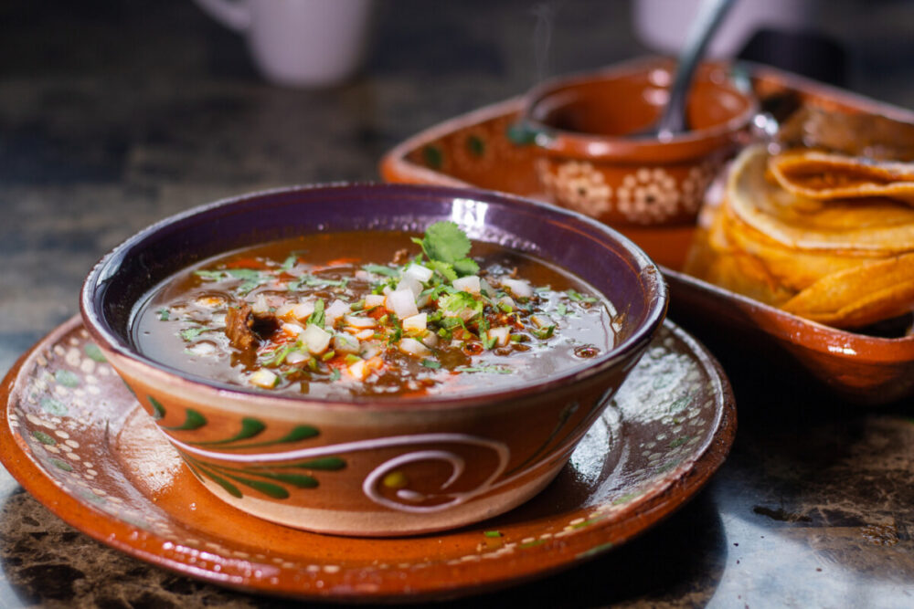 Some of the Best Worldwide Destinations For Food Lovers 6 Traditional Mexican dish with beef birria with red sauce. Mexican food