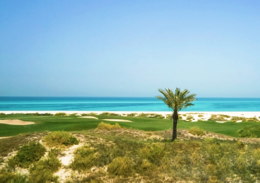 Why Saadiyat Island Is Abu Dhabi's Cultural Gem 1 The golf course with the Arabian Sea beyond. Saddiyat Island, Abu Dhubi.