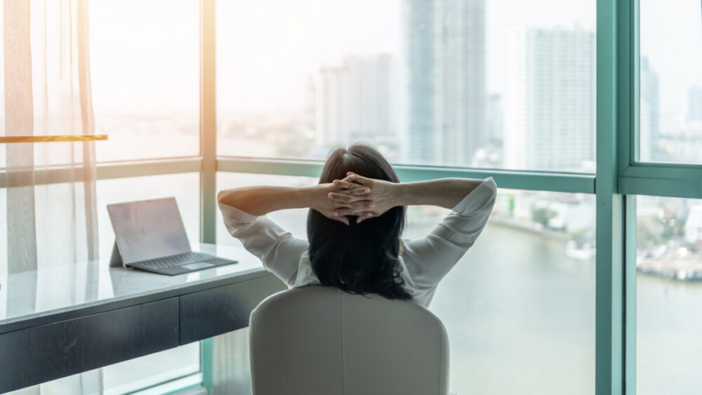 Work from home healthy lifestyle with Asian business woman relaxing take it easy resting in comfort hotel or living room having free time with peace of mind and self health balance