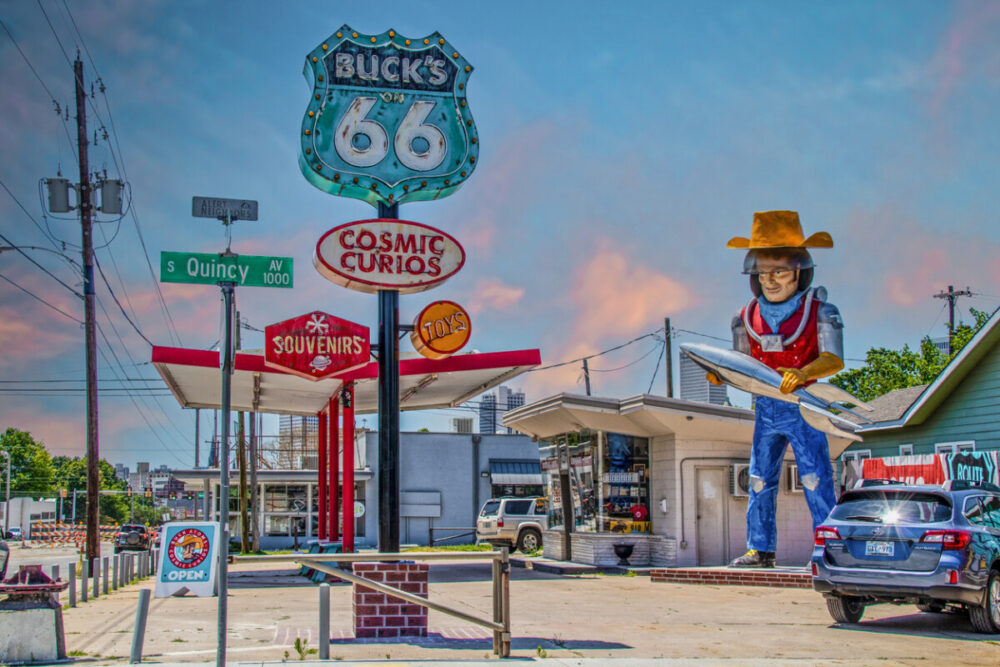The Rise of Purposeful Travel: What Road Trips Teach Us About Slowing Down 2 Curio and Souvenir Shop along Route 66 in Tulsa Oklahoma featuring statue of space cowboy holding rocket created from retro gas station.