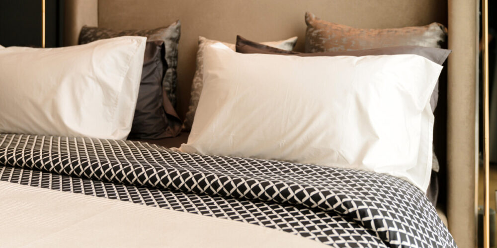 How Boutique Hotels Remember Your Favorite Room 1 house interior beautiful design concept with soft cozy pillow on white clean bed in bedroom with window sun light