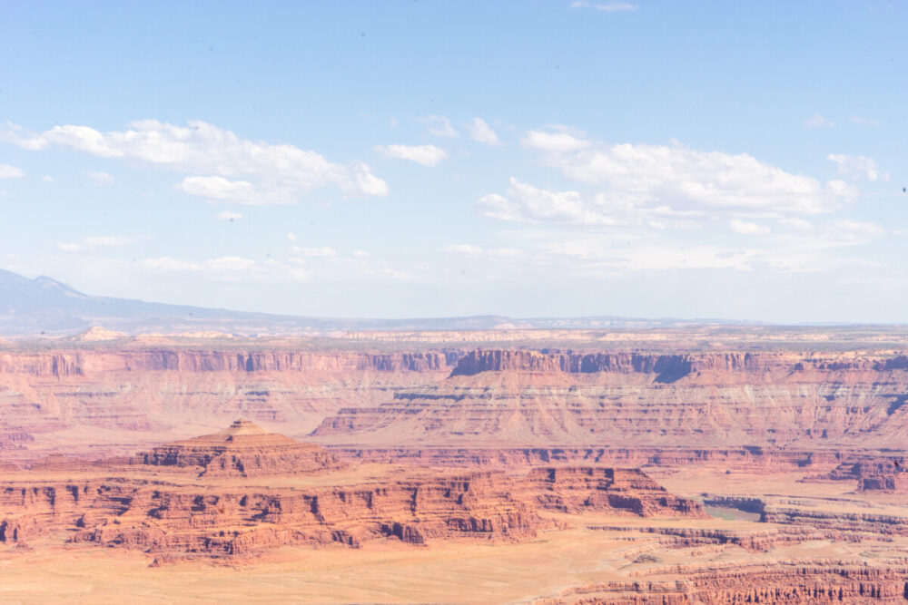 Desert scenery contrasts with the sky