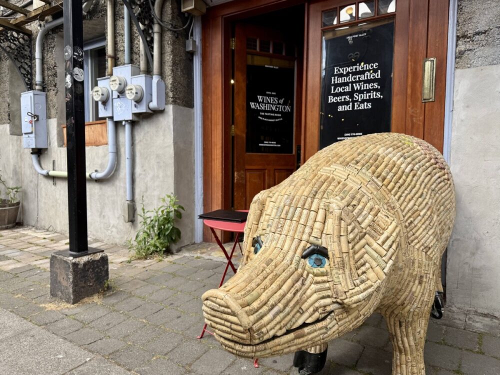 A Seattle Food Itinerary: 2 Days of Pike Place Market, Seafood, and Wine 8 pig made of cork standing outside a wine bar
