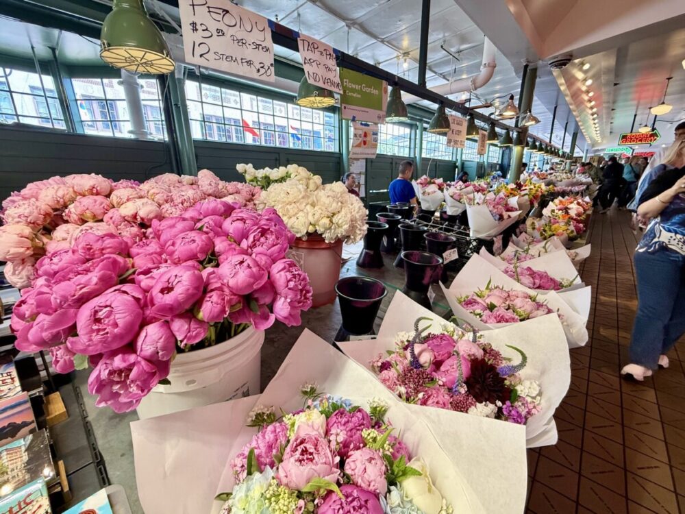 A Seattle Food Itinerary: 2 Days of Pike Place Market, Seafood, and Wine 4 flower stalls at Pike Place Market