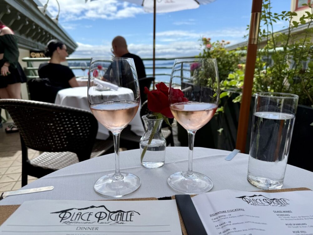 A Seattle Food Itinerary: 2 Days of Pike Place Market, Seafood, and Wine 7 outdoor table with two glasses of wine looking out over the water
