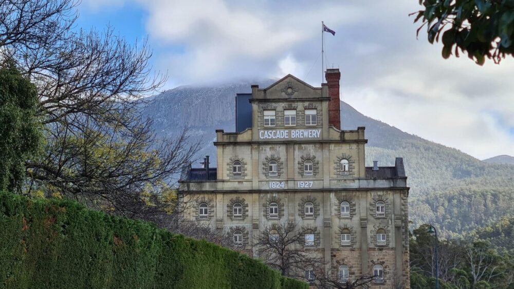Hobart Food Guide: 10 Things to Eat, Drink, and Do in Tasmania 7 brown concrete building near green grass field and mountain during daytime