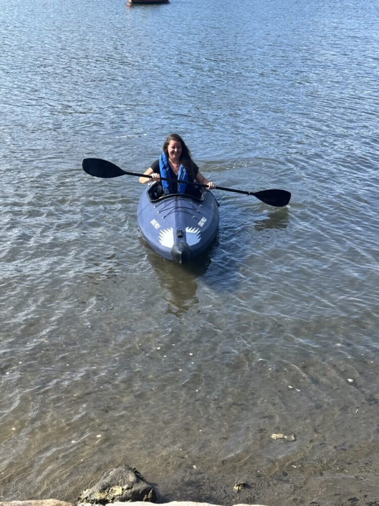 Razor Kayaks Edge Pro 1 Tried and Tested 2 caucasian woman paddling an inflatable kayak