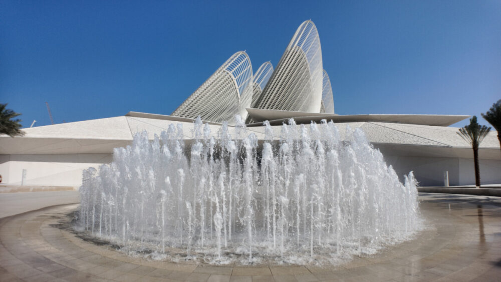 8 Helpful Resources for Planning a Saadiyat Island Trip 5 Zayed National Museum with falcon wing towers, fountain, and a graceful waterfall fronting Saadiyat Island
