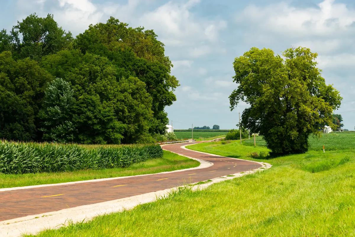 Route 66: The First 100 Years Book Review—A Century on the Mother Road 1 The historic Original Route 66 Brick Road on a sunny Summer afternoon in Auburn, Illinois, USA