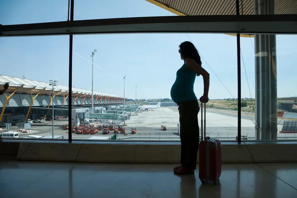 Best Electrolytes for Pregnancy: 7 Travel-Friendly Options Compared 1 silhouette of a pregnant woman in an airport