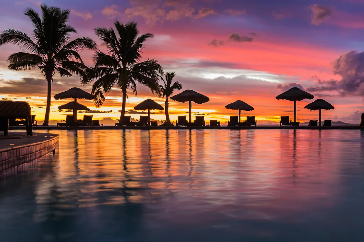Where to Stay in Fiji: Islands and Resorts by Travel Style 18 A beautiful sunset reflecting in the water in Fiji